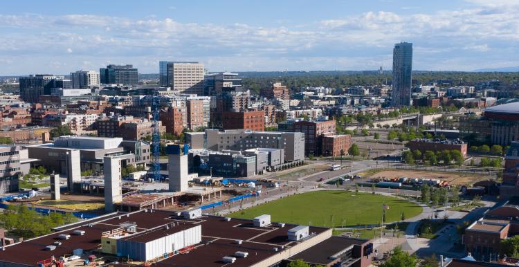 Aerial view of campus and Denver skyline.