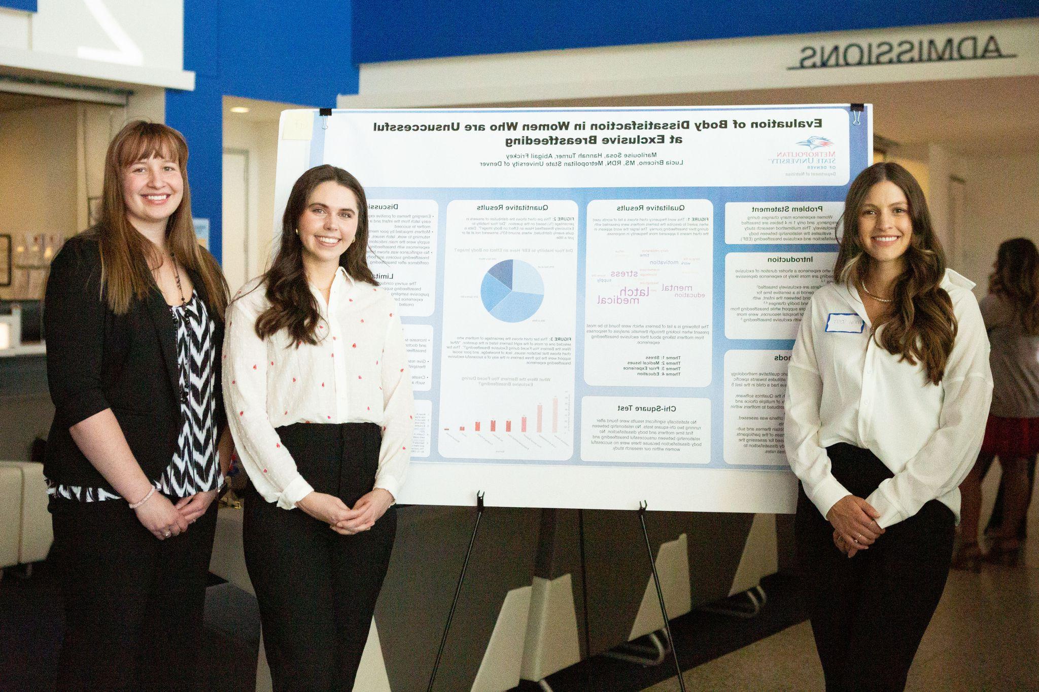 Students presenting at a conference