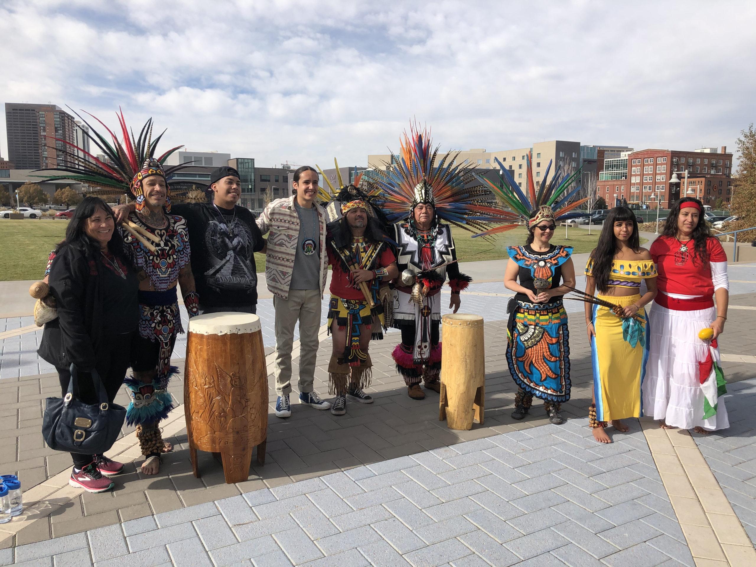 Author Xiuhtezcatl Martinez and a group of Indigenous Dancers posing for a photo