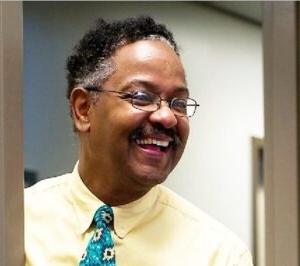 Image of Arthur Thomas standing in doorway smiling.